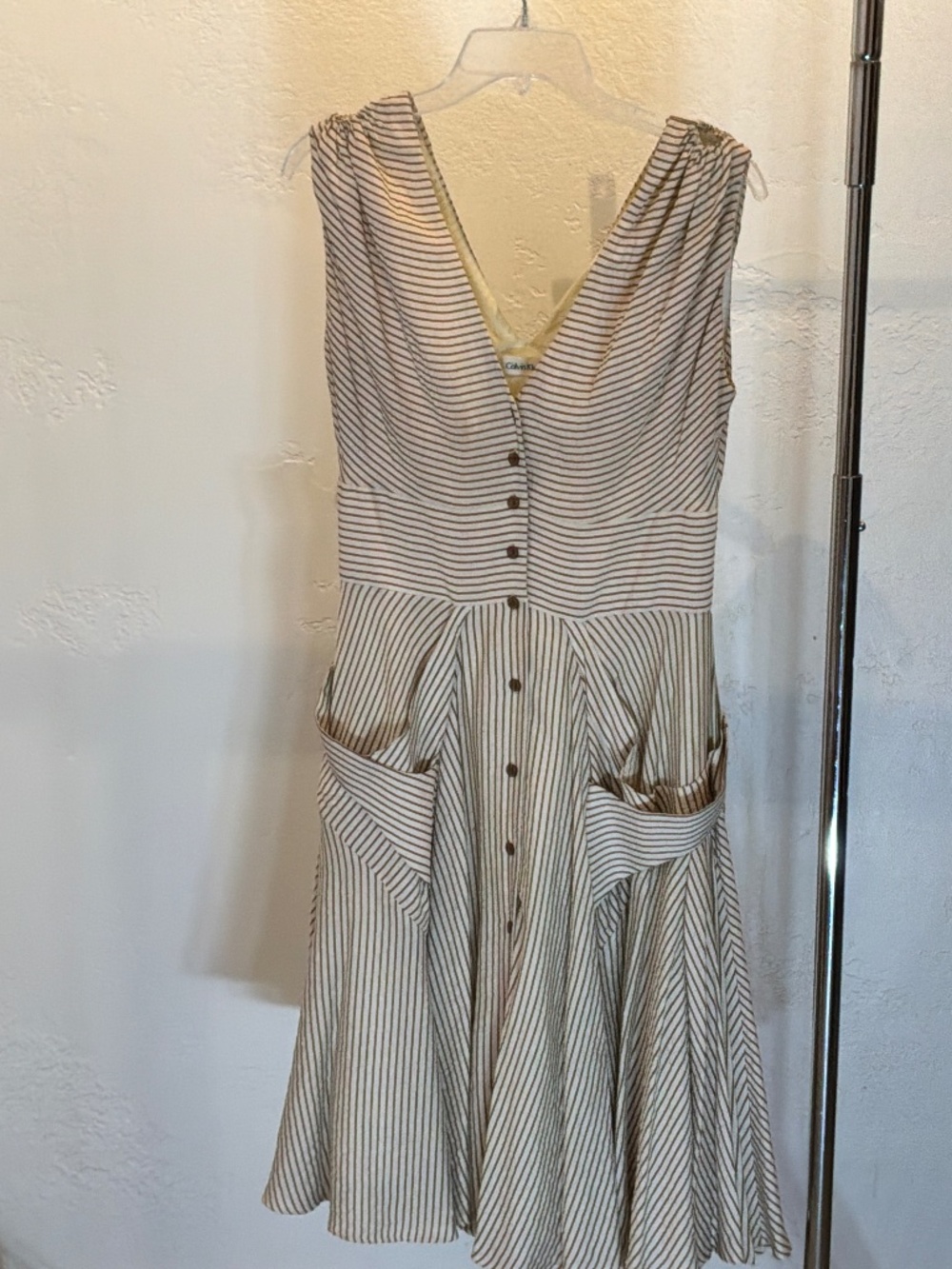 Calvin Klein tan and white Calvin Klein tan and white sleeve-less v neck dress
